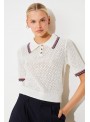 Polo de Suncoo, de tejido calado y manga corta. Perigue
