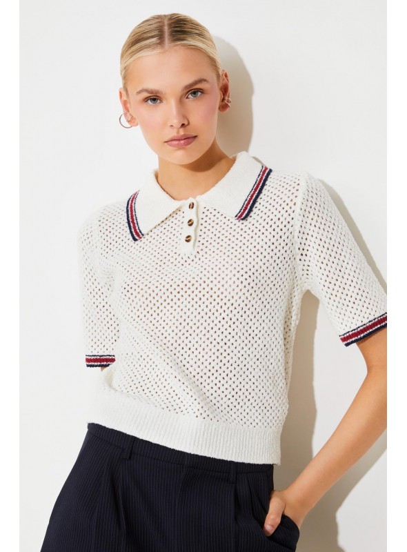 Polo de Suncoo, de tejido calado y manga corta. Perigue