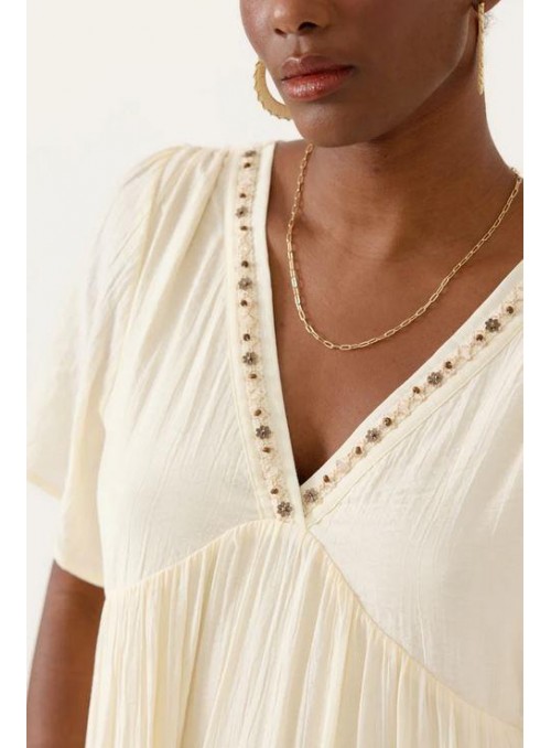Vestido Art Love, vaporoso en beige. Delaine